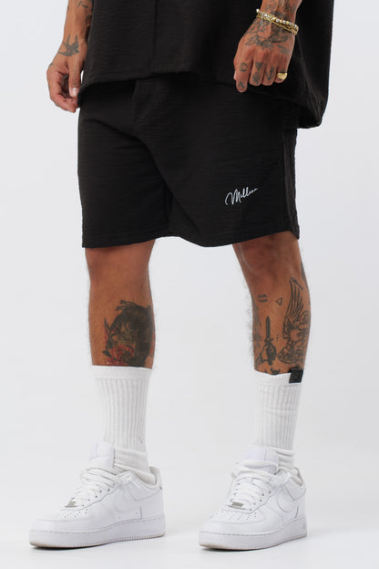 Schwarzes T-Shirt mit schwarzem Logo
